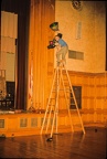 Dave Wilson aiming lights on trees built by WPI Lens &amp; Lights Club, Alden Memorial, 1965.