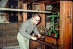Dave Wilson faking winding clock (electric by then) in tower of Boynton Hall, WPI, 1965.